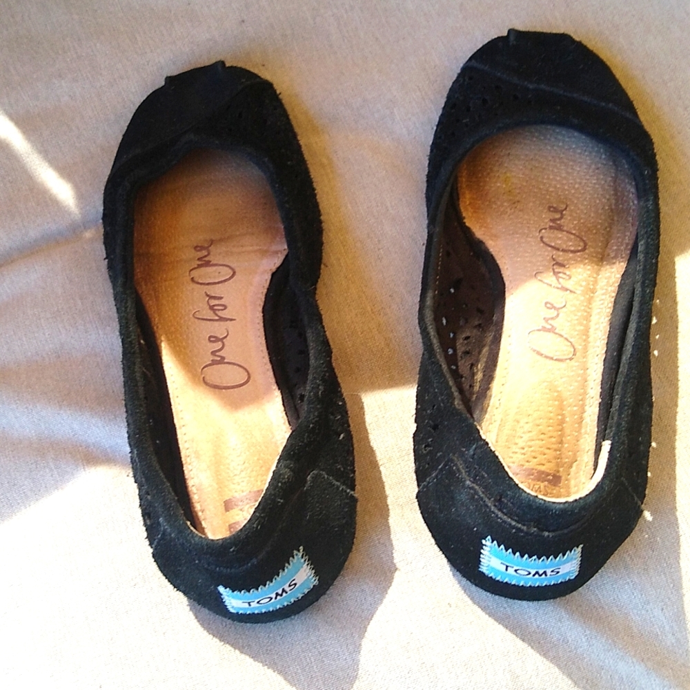 Toms One for One black ballet-style shoes.